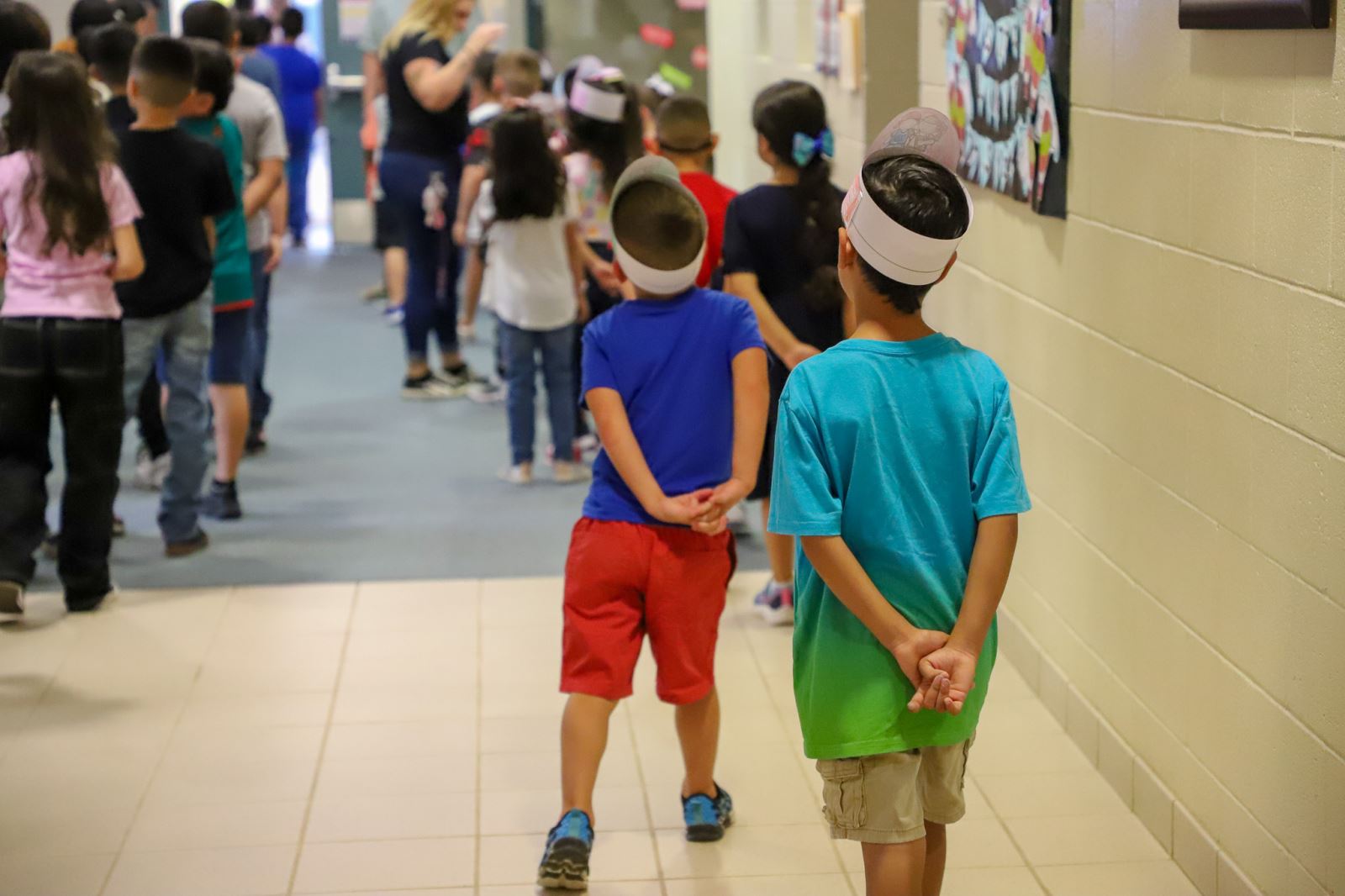 Students wait in the hallway on the first day of school.